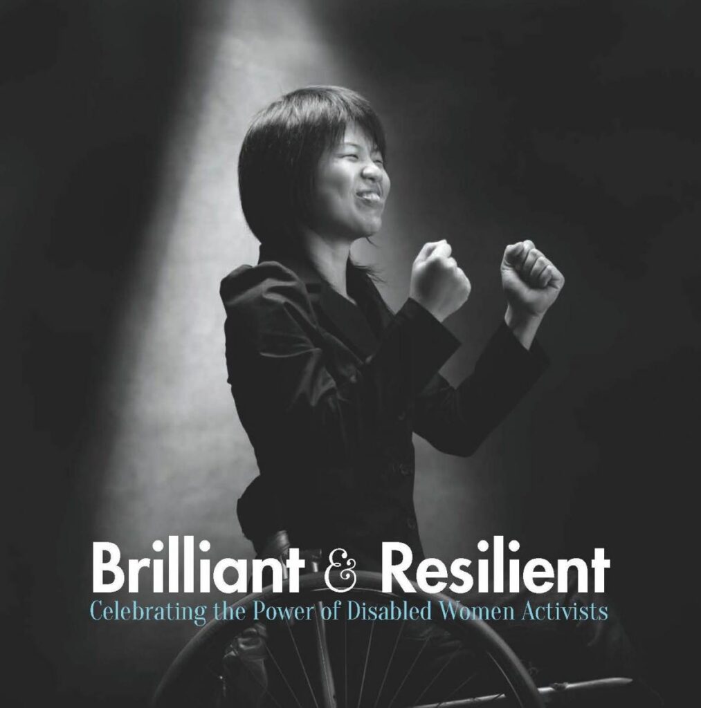 Book cover of Brilliant and Resilient features black and white portrait of smiling woman seated in wheelchair making powerful gesture