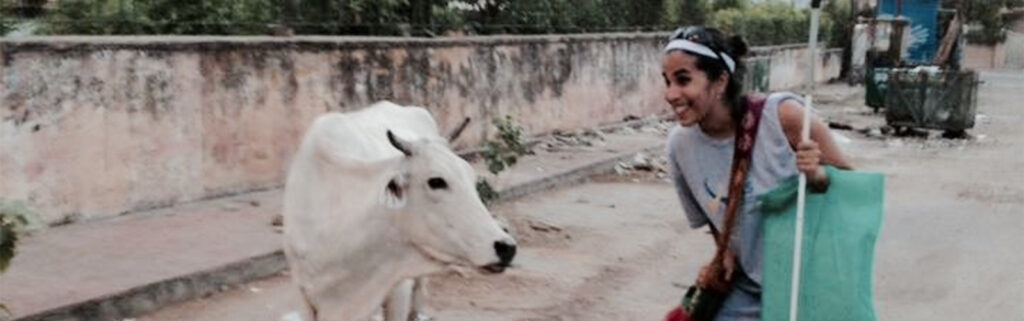 Esha Mehta encountering a cow in the streets of India