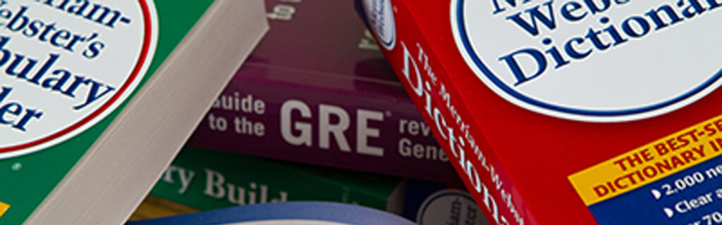 Stack of test books and dictionaries