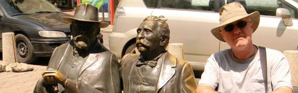 Jack Godwin with statue of father-son Bulgarian writers Petko and Pencho Slaveykov