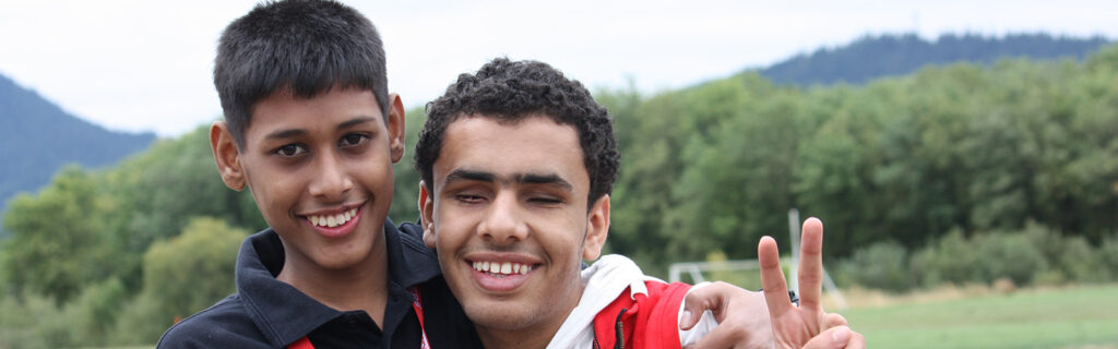 Two male exchange students smile at the camera