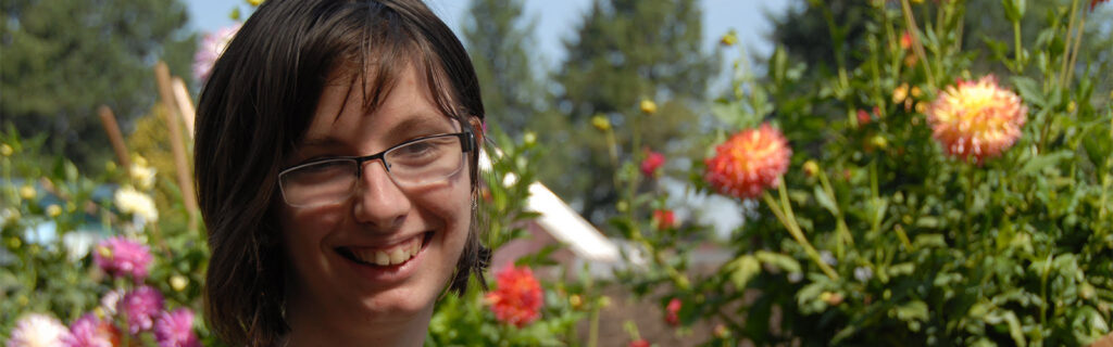 Senka smiles during a community garden activity.