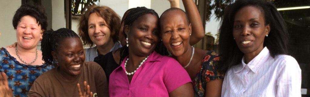 Smiling women at a disability rights training in Tanzania