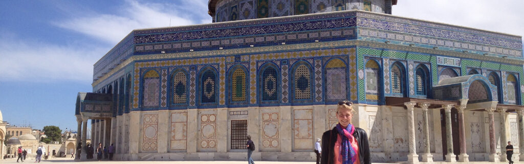 Tory Sampson in front of a colorful Mosque