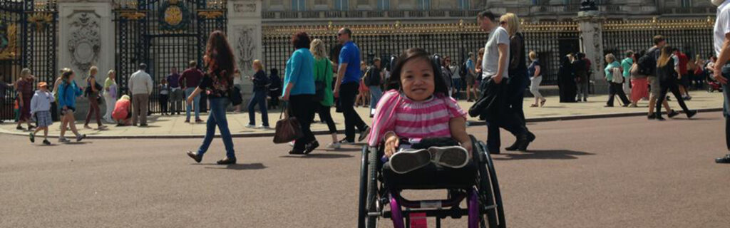 Xuan in her wheelchair outside Buckingham Palace