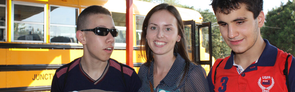 Exchange staff smiles with blind youth