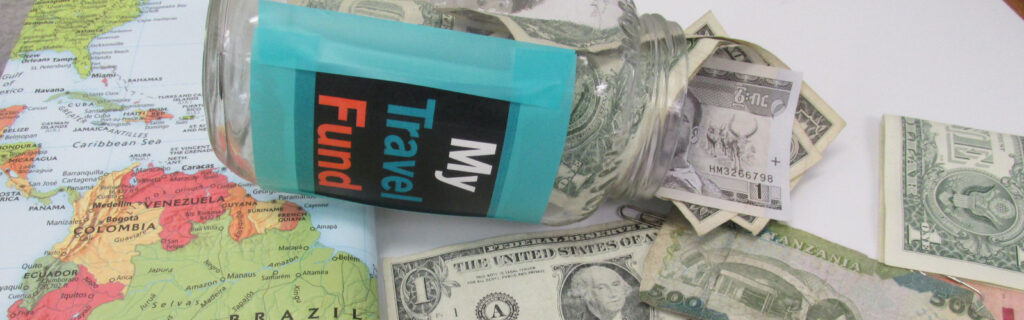 Money spills out of a jar labeled "My travel fund"