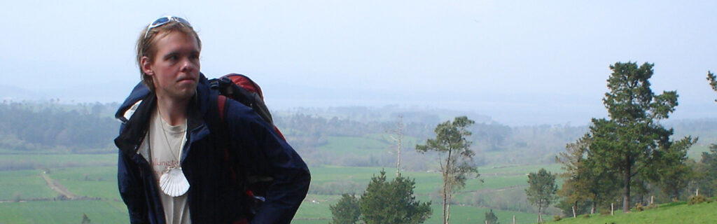 A young blind American man backpacks through the countryside.