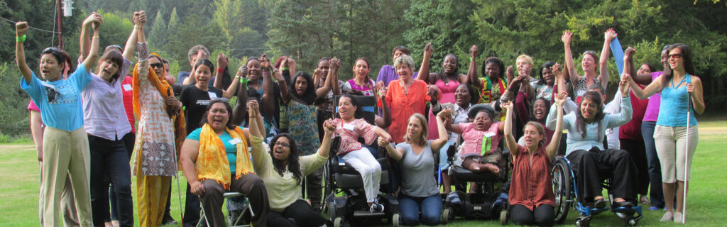 WILD women and resource people holding their hands in the air