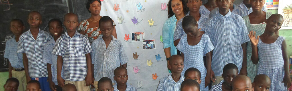 Teresa with students in classroom in Ghana