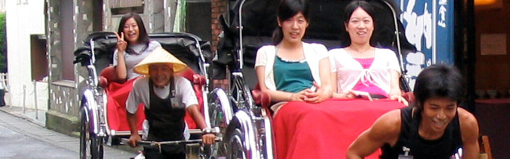 People being pulled in rickshaws in Asia