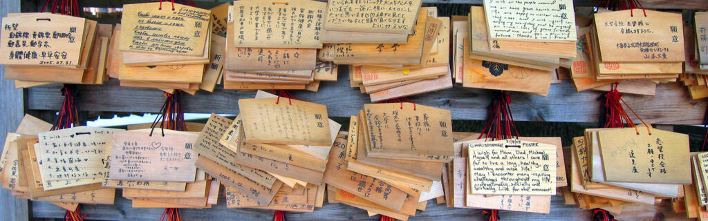 Various written wooden cards hanging