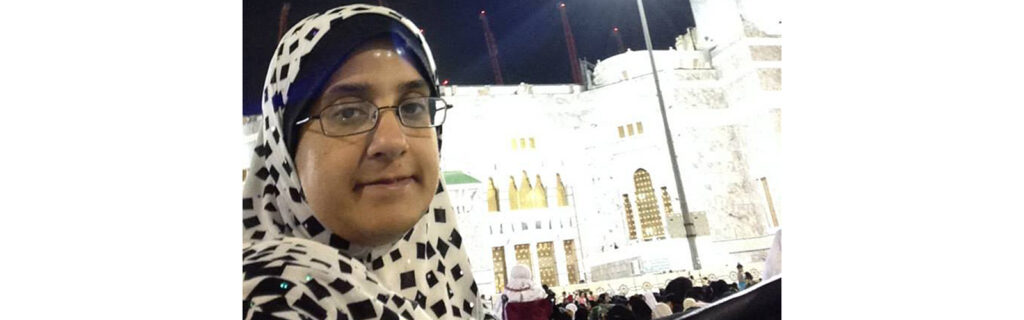 Picture of Bushra with a mosque in the background