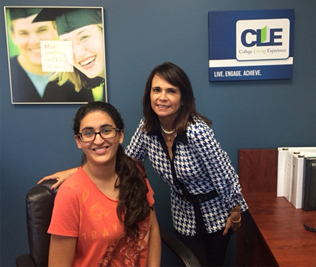 Gabriela at the CLE office smiling with mentor