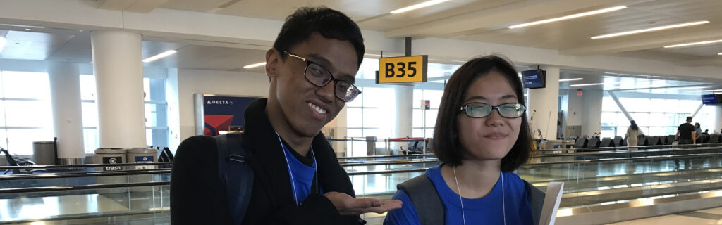 Hilmi and Syafiqah smile at airport