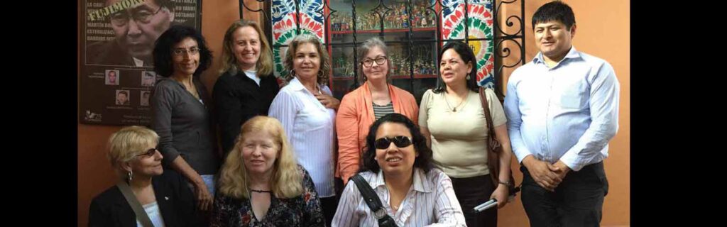 RightsNow! representatives, and members of APRODEH and CODIP in outside meeting room of APRODEH's office in Lima (five women and one man standing in back; three women sitting in front)