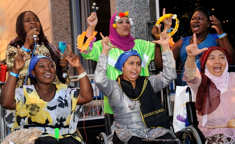 Cheering women with disabilities. Photo by Darcy Kiefel.