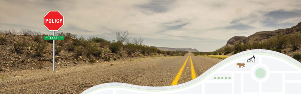 In the foreground graphic, a metal pole supports a red octagonal road sign labeled “Policy” and below it, a green sign labeled “Univ Texas El Paso.” In the background photo, we get a close-up of an asphalt road with double yellow center lines as it rolls away in the distance through sparse landscape with some rocky hills and scrub.