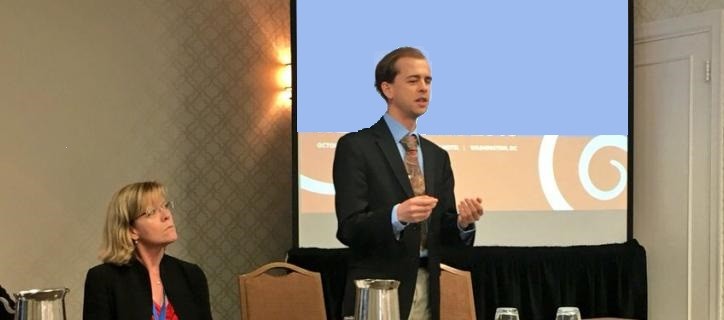hero Justin presenting PPT with panelists at GSA_0