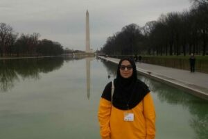 Asma standing in front of Washington, DC Monument pond.