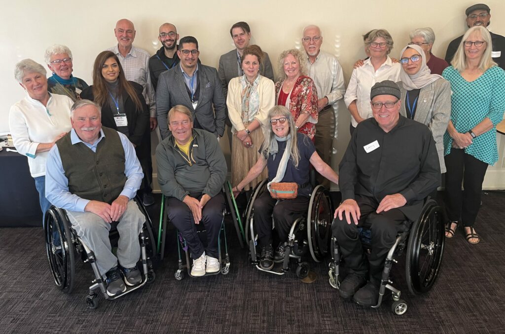 The Bahrain delegation with community members with and without disabilities